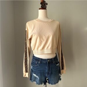 Kittenish cropped long sleeve top